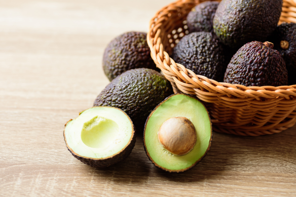 Avocados on a basket for Healthy Foods to Eat Everyday