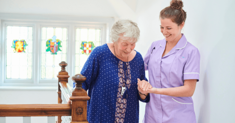 Social Care worker helping old lady